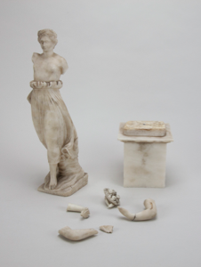 Image of Untitled [Statuette of a woman, walking topless]