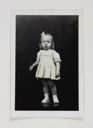 Image of Girl in White Dress Standing on Table