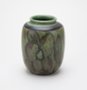 Image of Small Green Vase with Flower and Leaf Detail